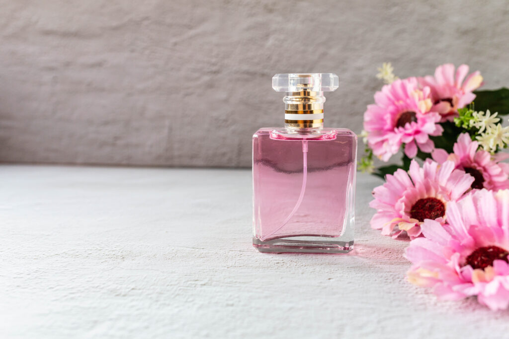 pink perfume bottle with pink flowers
